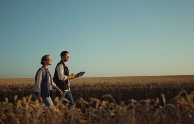 Two people on the Field Alberta Lamb producers (1)
